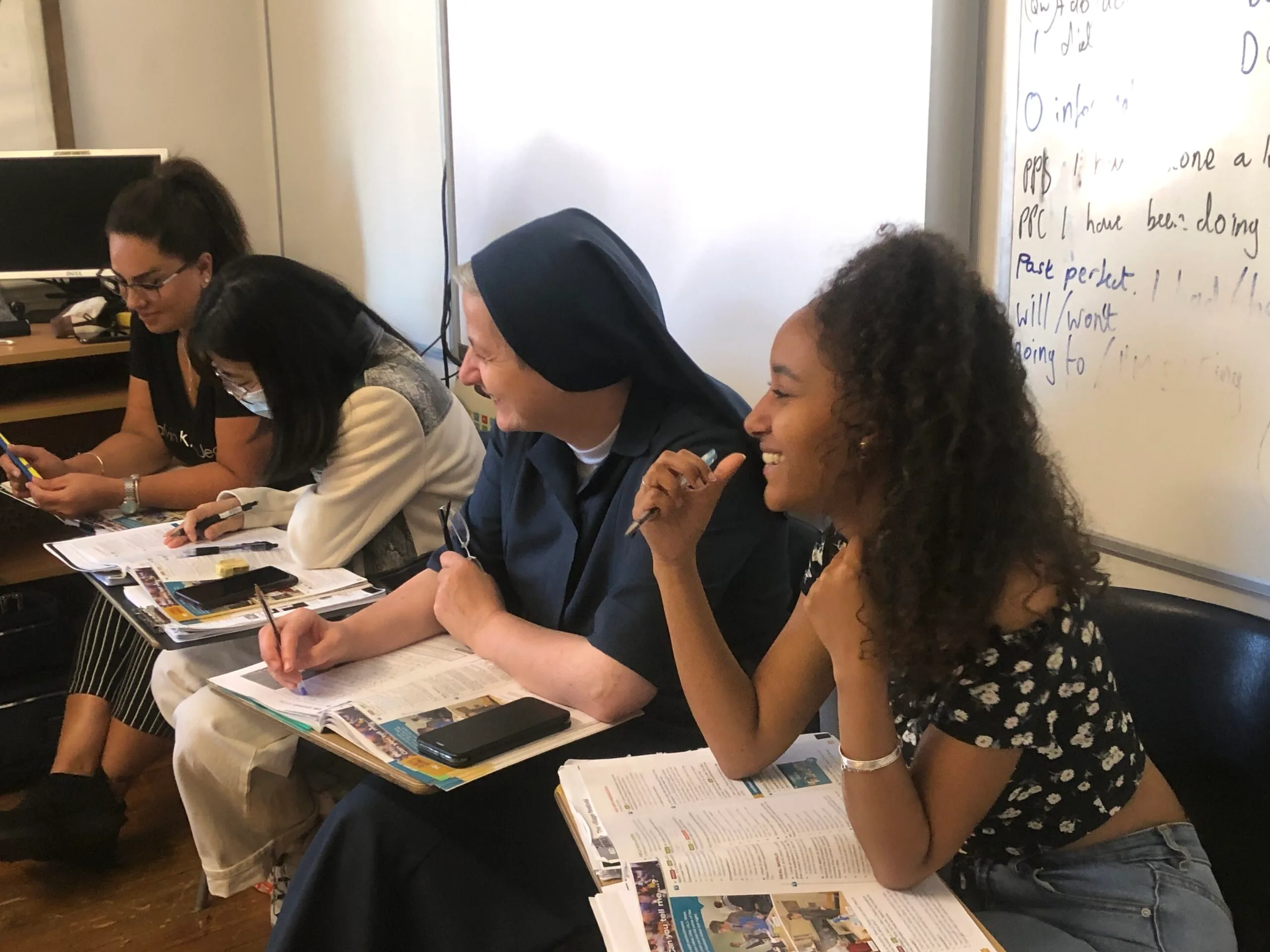 Diverse students working together on a project.